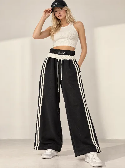 Damskie spodnie dresowe Wide Leg z lampasami – szeroka nogawka