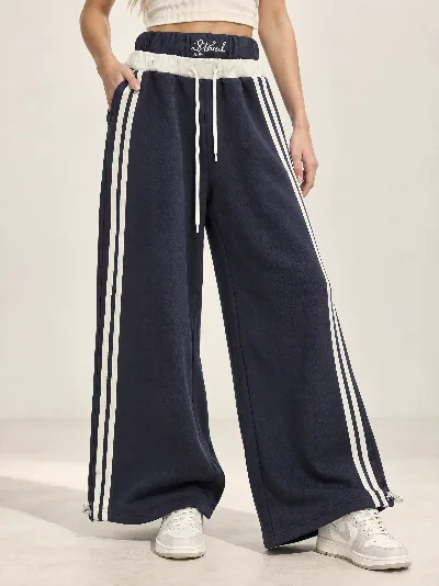 Damskie spodnie dresowe Wide Leg z lampasami – szeroka nogawka